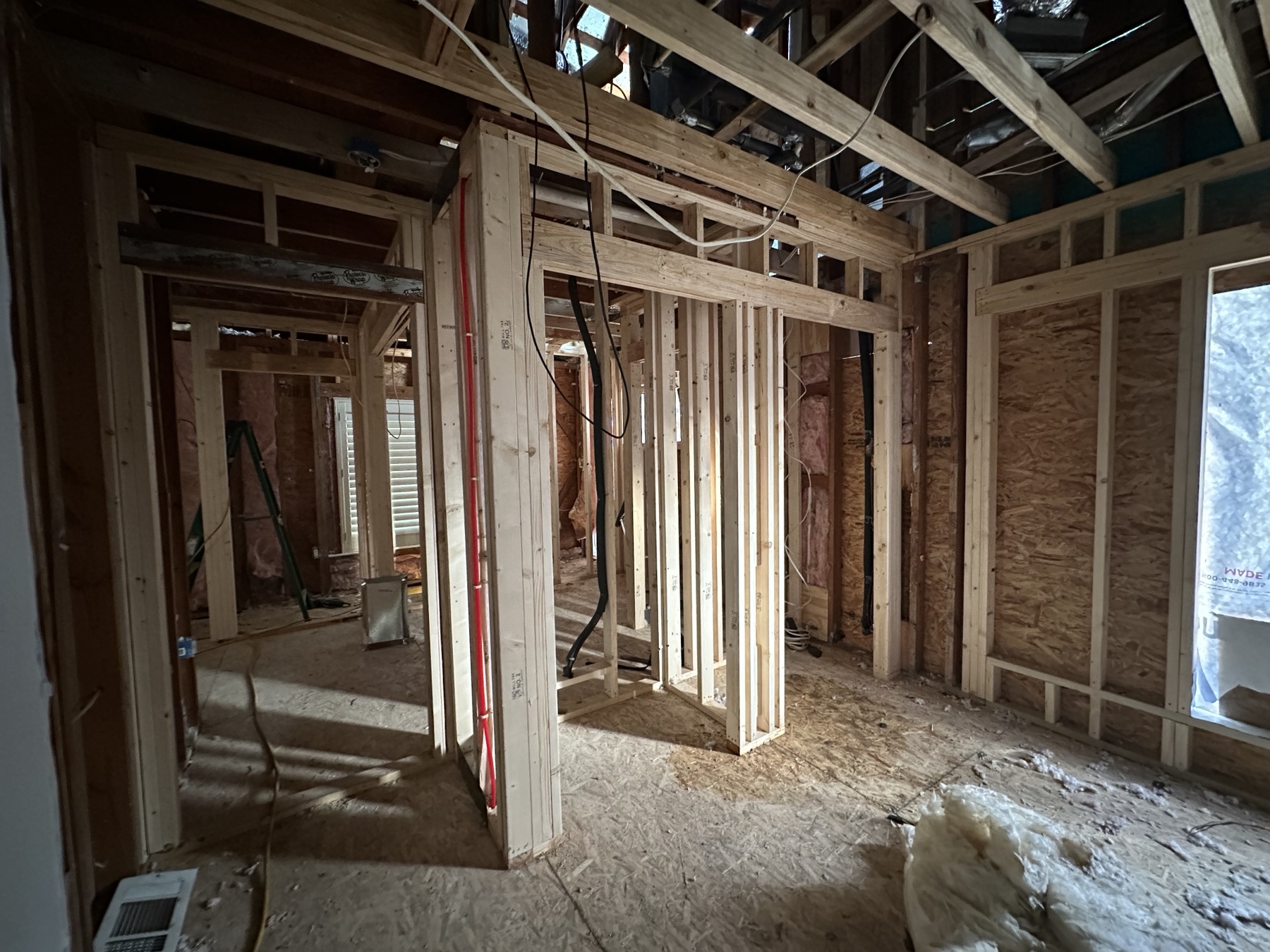 New wall and ceiling framing defining the bungalow's revised room layout
